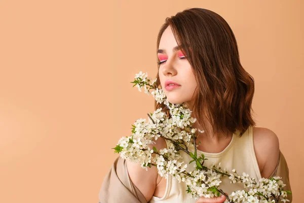 Beautiful Young Woman Blooming Spring Branches Color Background — Stock Photo, Image