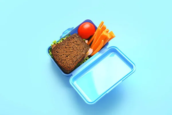 Lunchbox Mit Leckerem Essen Auf Farbigem Hintergrund — Stockfoto