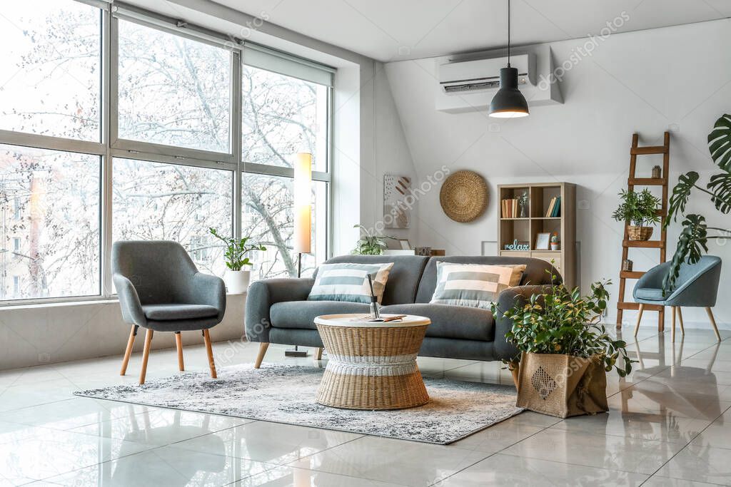 Interior of stylish living room with glowing lamps