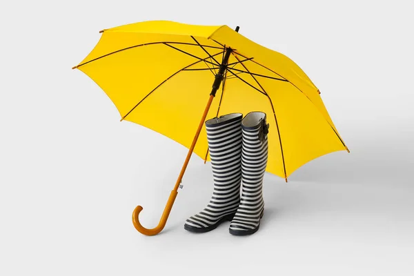 Stylish Umbrella Rubber Boots Light Background — Stock Photo, Image