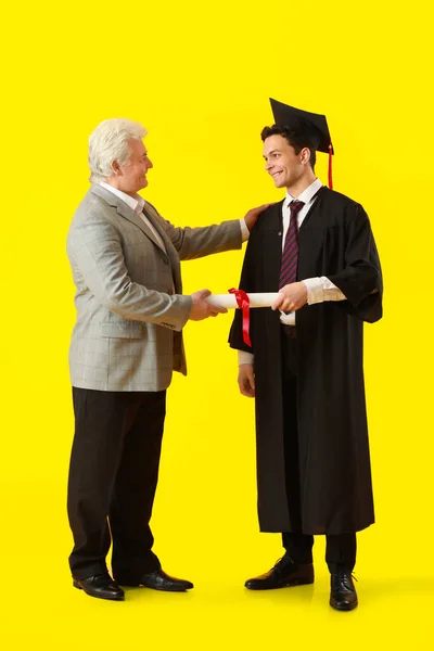 Happy Male Graduation Student His Father Color Background — Stock Photo, Image