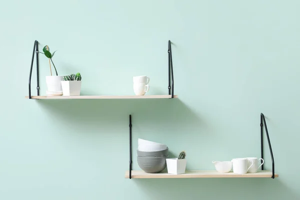 Modern shelves on kitchen wall