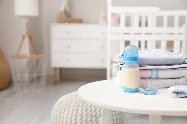Bottle Milk Baby Pacifier Clothes Table Room — Stock Photo, Image