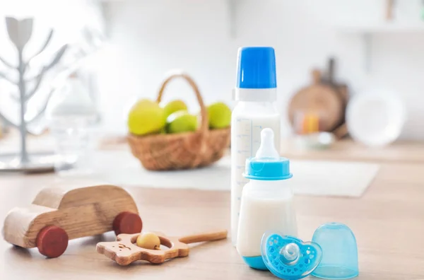Bottles Milk Baby Toys Table Kitchen — Stock Photo, Image