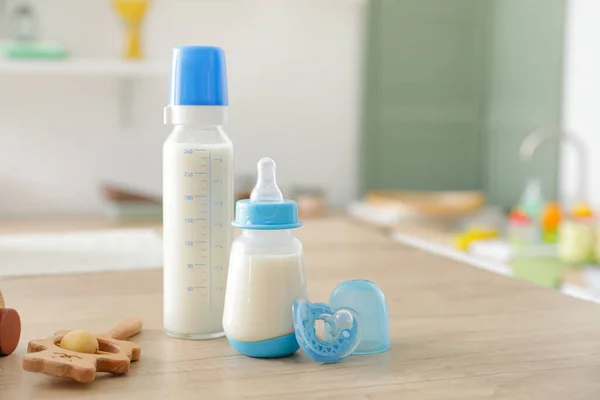 Bottles Milk Baby Toys Table Kitchen — Stock Photo, Image