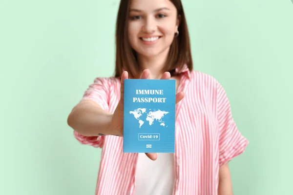 Young Woman Immune Passport Color Background — Stock Photo, Image