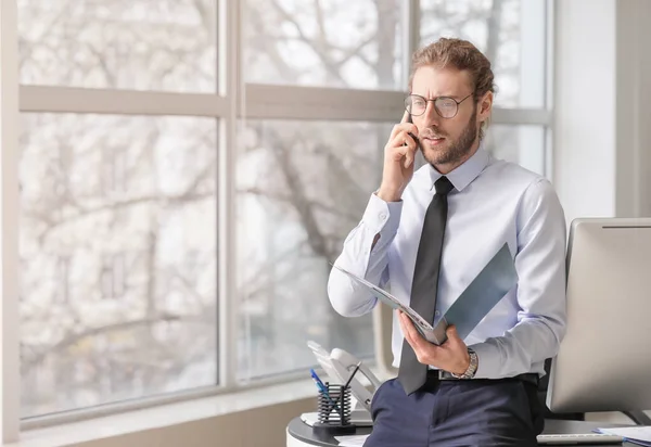 Tired Young Man Talking Mobile Phone Office — Stock Photo, Image