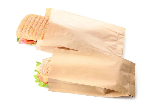 Taschen Mit Leckeren Ciabatta Sandwiches Auf Weißem Hintergrund — Stockfoto