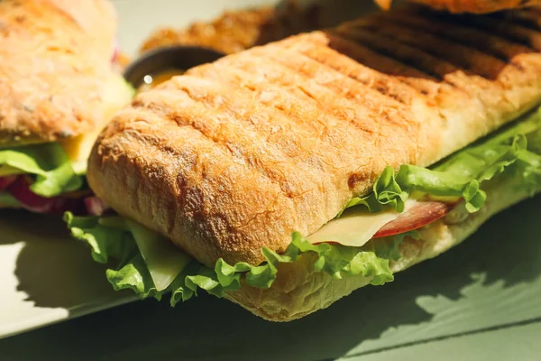 Plate Tasty Ciabatta Sandwiches Color Wooden Background — Stock Photo, Image