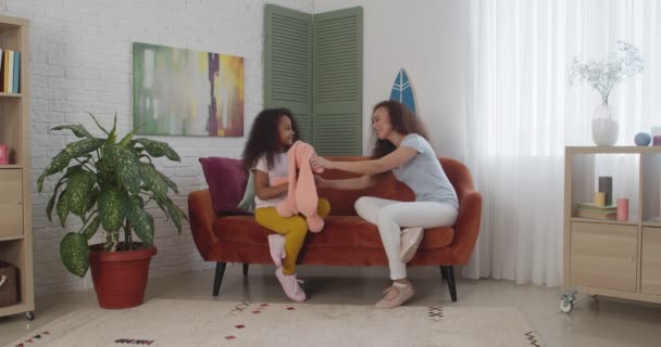 Young African American Woman Her Little Daughter Toy Sitting Sofa — Stock Video