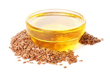 Keten yağlı kase ve beyaz arka planda tohumlar