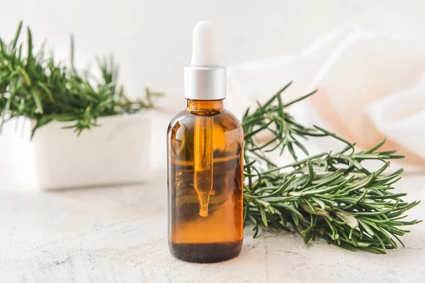 Bottle Essential Oil Fresh Rosemary Light Background — Stock Photo, Image