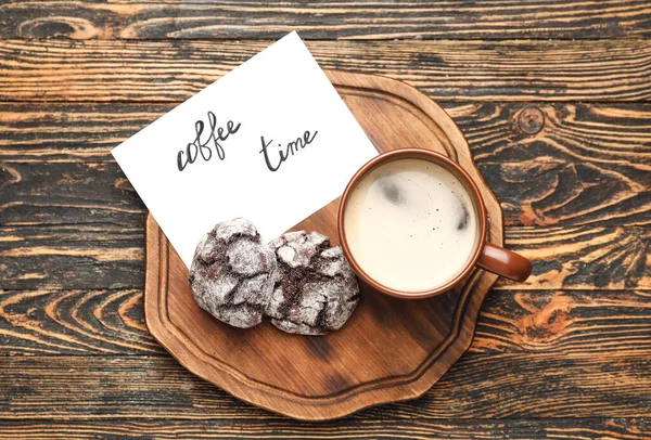 Paper with text COFFEE TIME, cookies and cup of hot beverage on wooden table