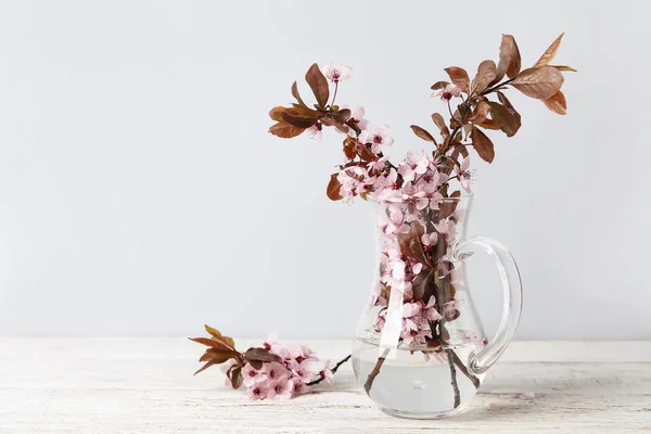 Vase Beautiful Blossoming Branches Table Light Background — Stock Photo, Image