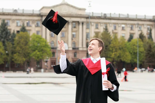 Portrait Male Graduating Student Throwing Cap Outdoors — Stock Photo, Image