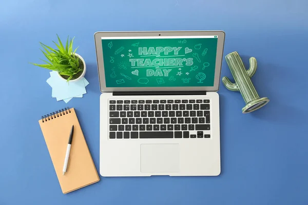 Text HAPPY TEACHER\'S DAY on screen of laptop against color background