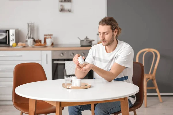 Handsome Young Man Taking Pills Kitchen — Stock Photo, Image