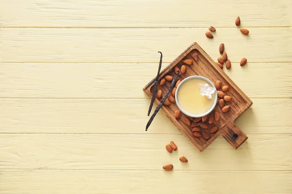 Board Tasty Vanilla Pudding Ramekin Almond Color Wooden Background — Stock Photo, Image