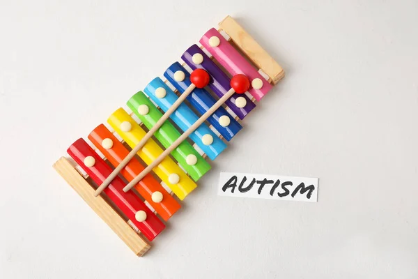 Word Autism Xylophone Light Background — Stock Photo, Image