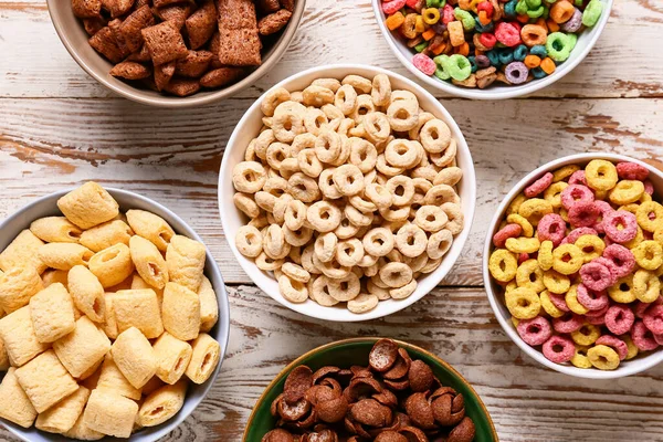 Bowls Different Cereals Light Wooden Background Closeup — Stock Photo, Image