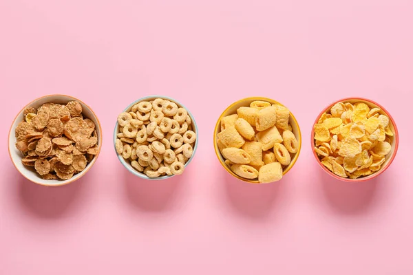 Cuencos Con Diferentes Cereales Sobre Fondo Color —  Fotos de Stock