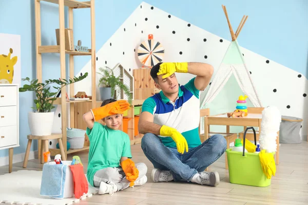 Tired Father Son Cleaning Supplies Home — Stock Photo, Image