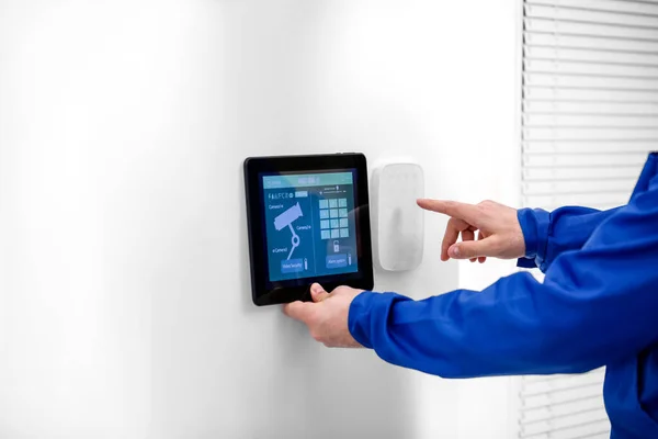 Worker Tablet Computer Checking Alarm System Indoors — Stock Photo, Image