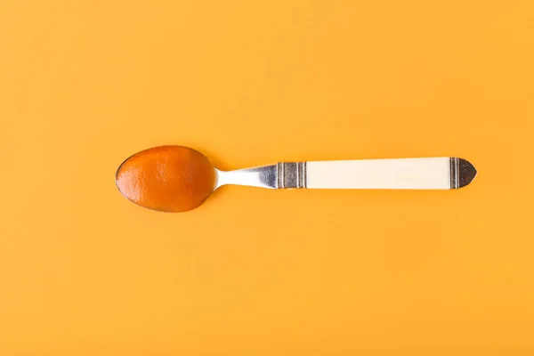 Spoon Tasty Apricot Jam Color Background — Stock Photo, Image