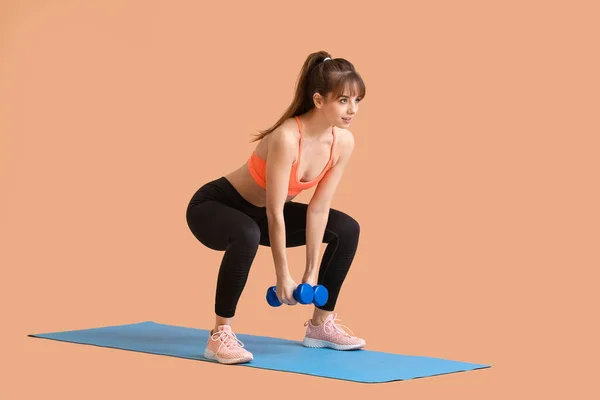 Sporty Young Woman Training Dumbbells Color Background — Stock Photo, Image