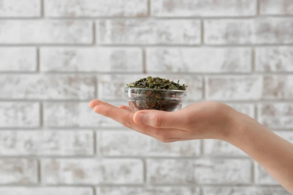 Female Hand Bowl Green Tea Brick Background — Stock Photo, Image