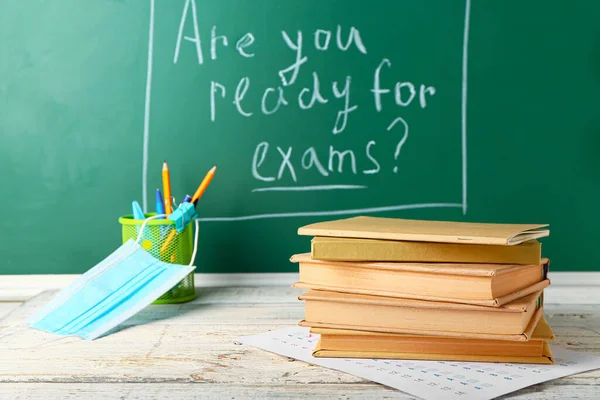 Books Answer Sheet Stationery Mask Table Blackboard Text You Ready — Stock Photo, Image