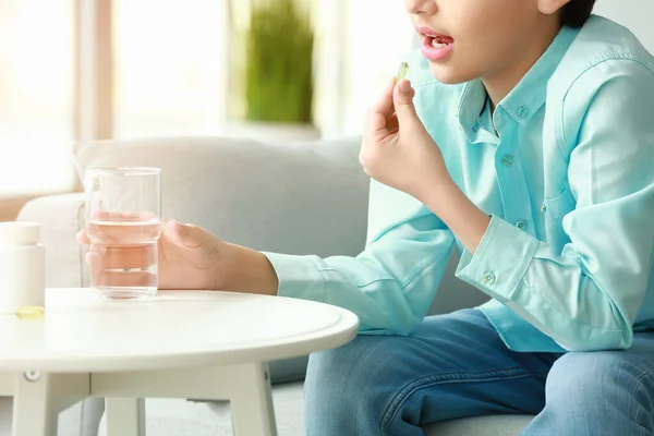 Little Boy Taking Fish Oil Pill Home — Stock Fotó