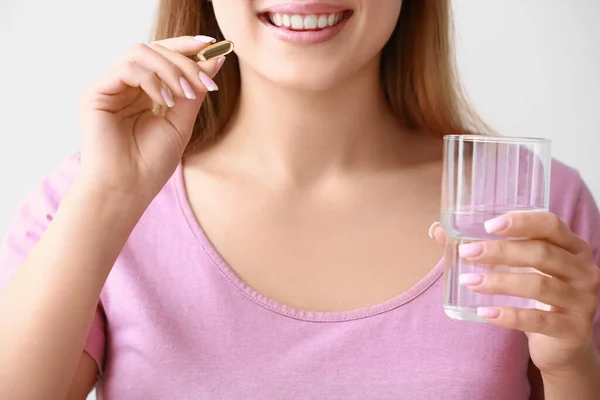 Young Woman Fish Oil Pill Light Background Closeup — Stock Photo, Image