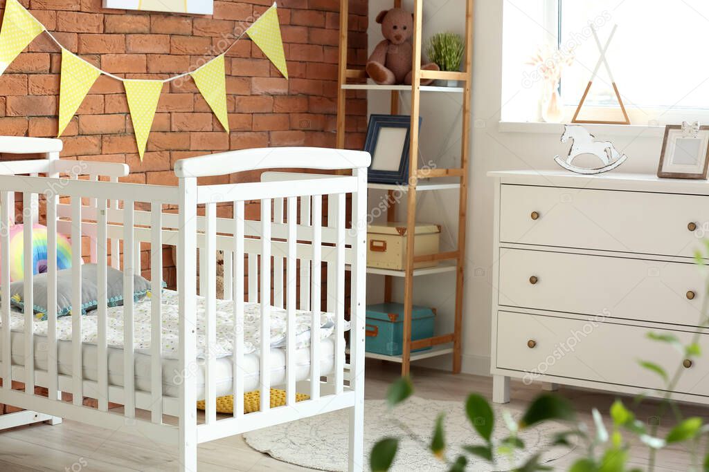 Stylish interior of modern children's room with comfortable bed