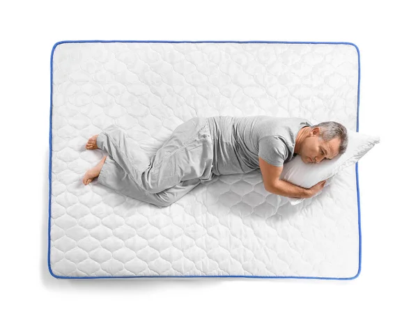 Mature Man Lying Soft Mattress White Background — Stock Photo, Image