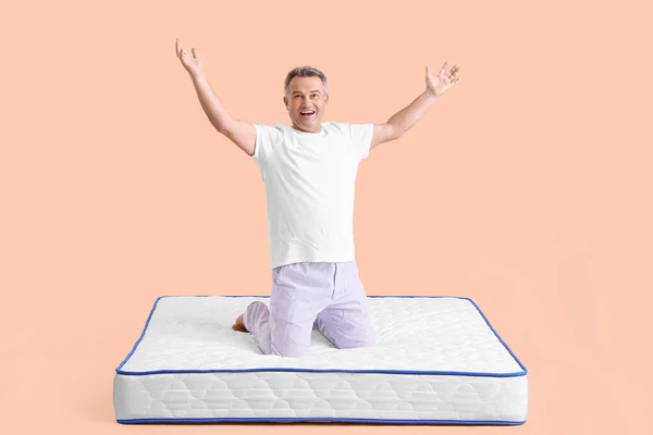 Happy Mature Man Soft Mattress Color Background — Stock Photo, Image