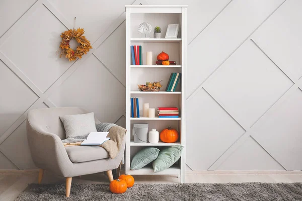Stylish interior of living room with autumn decor
