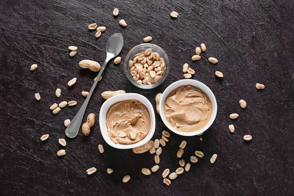 Bowls Tasty Peanut Butter Dark Background — Stock Photo, Image