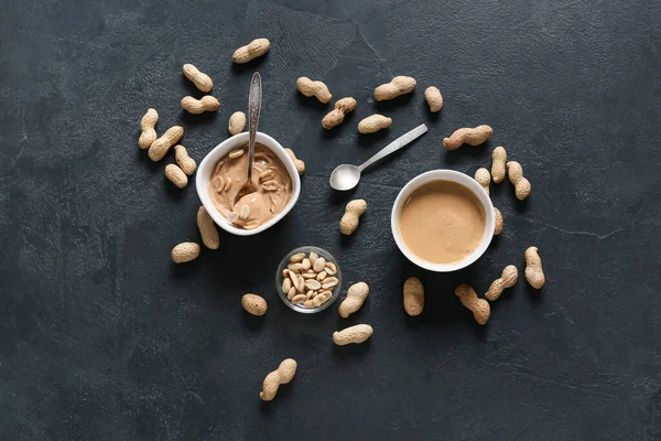 Tasty Peanut Butter Nuts Dark Background — Stock Photo, Image