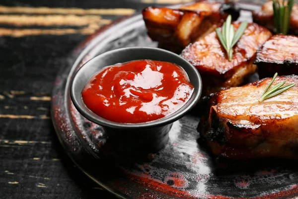 Plate Tasty Barbecue Sauce Roasted Pork Dark Wooden Background — Stock Photo, Image