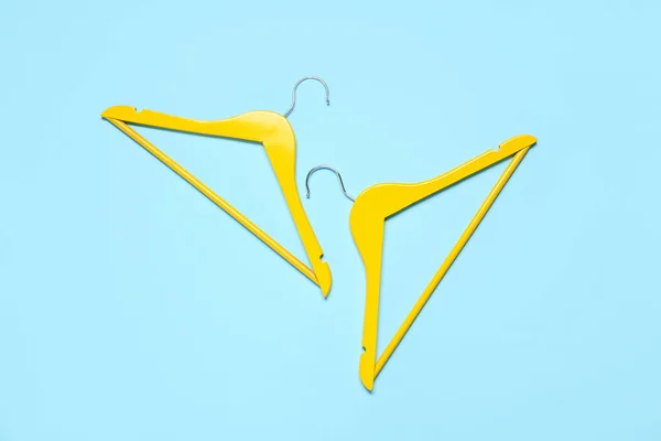 Stylish Clothes Hangers Color Background — Stock Photo, Image