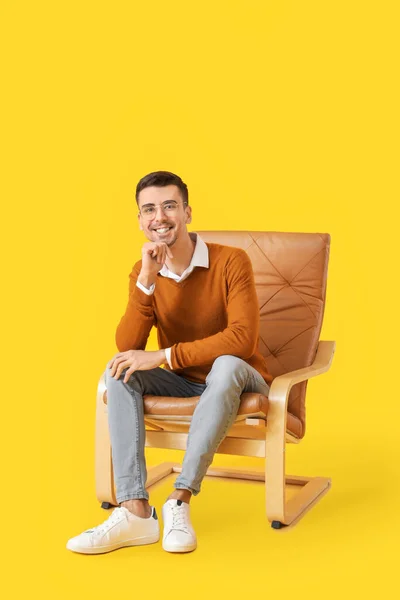 Young Man Sitting Armchair Color Background — Stock Photo, Image