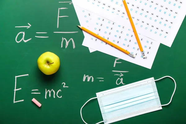 Answer Sheets Pencils Mask Apple Blackboard — Stock Photo, Image