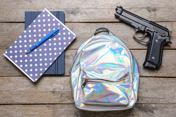 Pistol Backpack Stationery Wooden Background Concept School Shooting — Stock Photo, Image