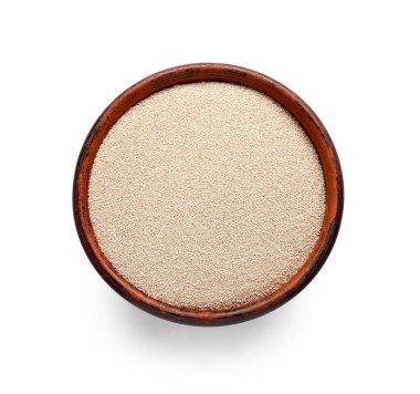 Beyaz arkaplanda etkin kuru maya olan bowling topu