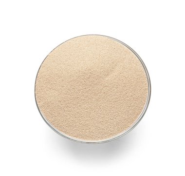 Beyaz arkaplanda etkin kuru maya olan bowling topu