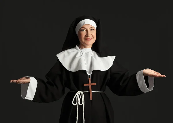 stock image Mature nun on dark background