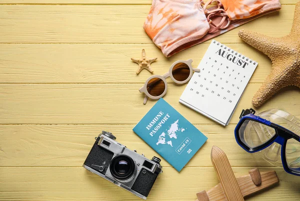 Calendar Beach Accessories Immune Passport Color Wooden Background — Stock Photo, Image