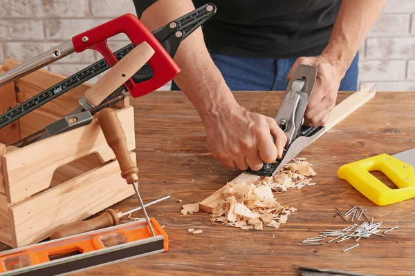 Carpenter Planing Plank Wooden Table — Stock Photo, Image