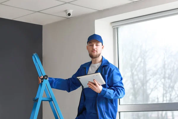 Worker Installing Alarm System Indoors — Stock Photo, Image